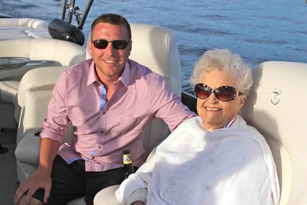 Tim with his beloved Grandma Nonny on a boat